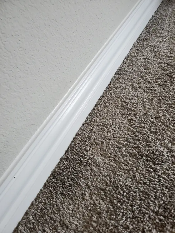 Baseboards hand-wiped